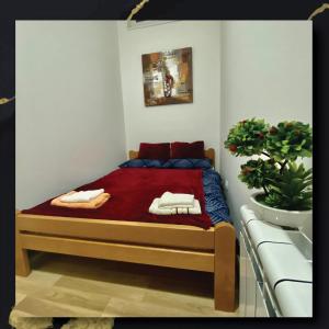 Postel nebo postele na pokoji v ubytování Sky Apartman