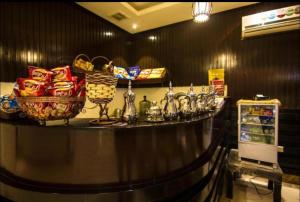a counter in a store with baskets of food at Al Makan Suites 102 by Al Azmy in Riyadh
