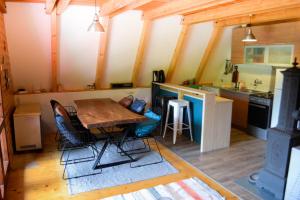a kitchen with a table and chairs in a room at Cabin & Apartment Kopaonik in Kopaonik