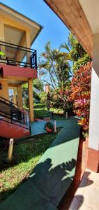 a view of a house with a green walkway at Hospedaje Jose Gorgues in Puerto Iguazú