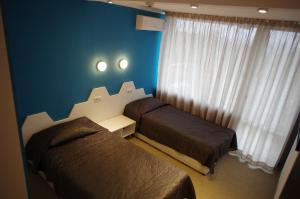 Łóżko lub łóżka w pokoju w obiekcie Sports&Hotel Aqua Life Tower
