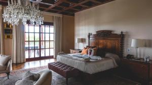 A bed or beds in a room at Hotel & Hacienda La Caravedo