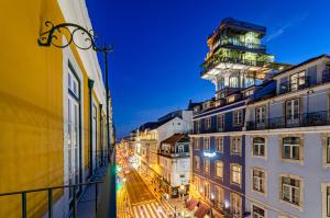 a view of a city street at night at Rossio Plaza Hotel in Lisbon