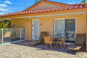 a patio with a table and chairs on a house at Beach Villa 1B in Holmes Beach