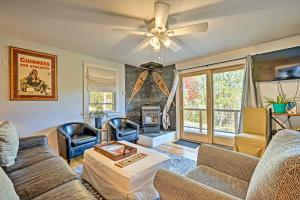 a living room with couches and a ceiling fan at Stratton Mountain Home with View - 2 Mi to Ski Lift! in Stratton