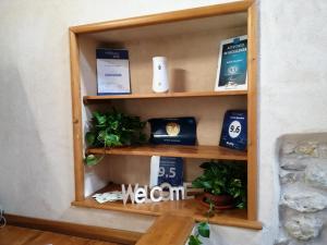 a shelf in a room with products on it at Antichi Quartieri in Piazza Armerina