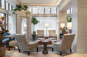 a living room with two chairs and a table at Woodlark in Portland