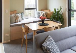 a living room with a couch and a table at Lily Cottage - Lake Tekapo in Lake Tekapo