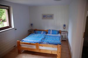 Postel nebo postele na pokoji v ubytování Haus Garten am Meer