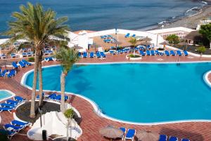an overhead view of a swimming pool at a resort at Sandos Papagayo in Playa Blanca