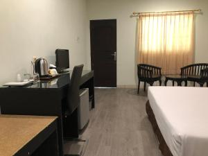 Postel nebo postele na pokoji v ubytování Hotel Sinar 3