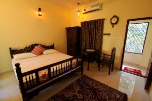 Ένα ή περισσότερα κρεβάτια σε δωμάτιο στο Nirrvaan homestay
