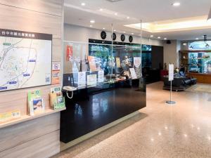 a store with a map on the wall and a display case at Fudi Hotel in Taichung