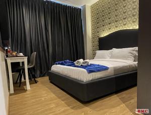 Postel nebo postele na pokoji v ubytování BMC Hotel + 37 fotografií