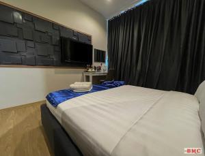 Postel nebo postele na pokoji v ubytování BMC Hotel
