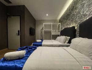 Postel nebo postele na pokoji v ubytování BMC Hotel