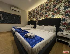 Postel nebo postele na pokoji v ubytování BMC Hotel