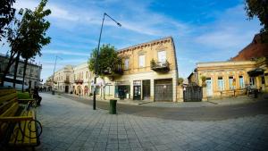 an empty city street with buildings on the corner at ALINA'S ROOM in Kutaisi