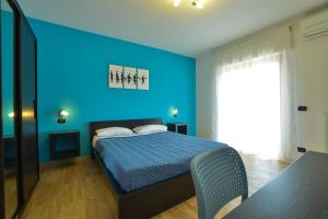Postel nebo postele na pokoji v ubytování MozÁrt Bed & Breakfast - Affittacamere
