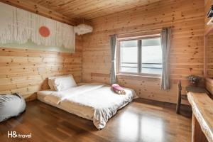 Postel nebo postele na pokoji v ubytování Alishan Sunrise B&B