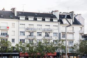 a large building with a lot of windows on top of it at le paris brest hotel in Rennes