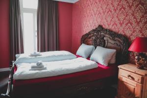 Rúm í herbergi á Historisches Hotel Bären