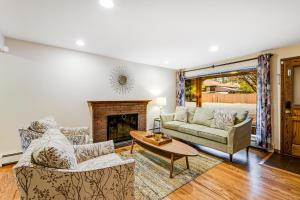 a living room with a couch and a fireplace at Victory Heights Retreat in Seattle