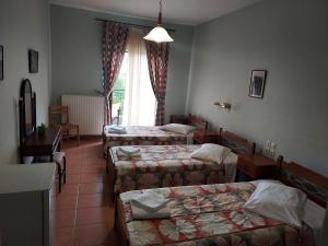 Postel nebo postele na pokoji v ubytování Miaritis rooms