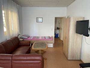TV a/nebo společenská místnost v ubytování Fam M & H Schöne 4 Zimmer in Wangen Im Allgäu