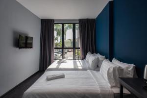 Postel nebo postele na pokoji v ubytování Chariton Hotel Bagan