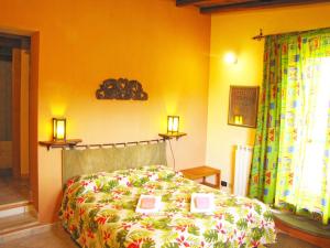 a bedroom with a bed with books on it at B&B Ai Glicini - Castelli Romani in Marino