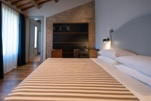 Letto o letti in una camera di Sei Sequoie Nature & Charme