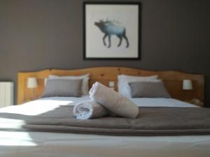 Voodi või voodid majutusasutuse Hôtel Aalborg toas
