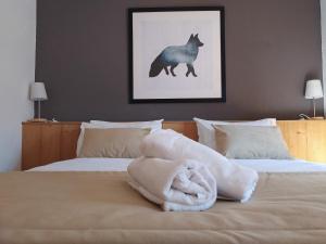 Voodi või voodid majutusasutuse Hôtel Aalborg toas