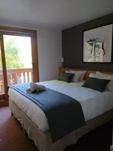 Voodi või voodid majutusasutuse Hôtel Aalborg toas