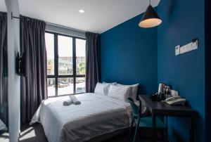 Postel nebo postele na pokoji v ubytování Chariton Hotel Bagan