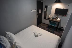 Postel nebo postele na pokoji v ubytování Chariton Hotel Bagan