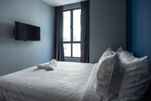 Postel nebo postele na pokoji v ubytování Chariton Hotel Bagan