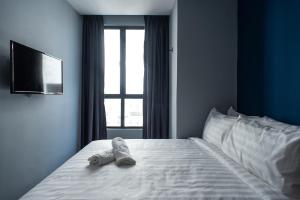 Postel nebo postele na pokoji v ubytování Chariton Hotel Bagan