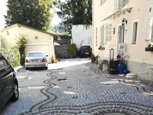a cobblestone street in front of a house at Villa Bariole in Bad Reichenhall