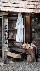 a white towel hanging on the side of a cabin at Iz de Maramures Rural Hotel in Şurdeşti