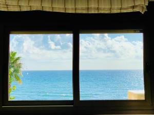 a view of the ocean from a window at SOLANA Montemar Puerto in Torremolinos