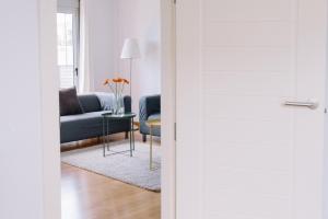 a living room with a couch and a table at Cornisa Apartments in Patalavaca