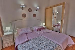 Postel nebo postele na pokoji v ubytování Bungalow Santa Fe con gran terraza