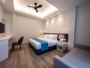 מיטה או מיטות בחדר ב-Sky Beach Maldives - Dhiffushi