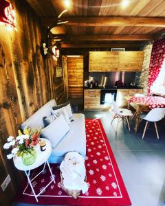 a living room with a couch and a table at Chalet Salet in Vernante