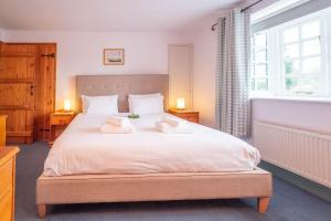 Cama o camas de una habitación en Micawbers - Aldeburgh Coastal Cottages