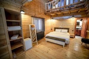 Postel nebo postele na pokoji v ubytování Pino Mar Luxury Bungalows