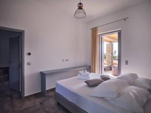 Posteľ alebo postele v izbe v ubytovaní Villa Olea Paros