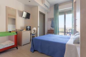 Postel nebo postele na pokoji v ubytování Hotel Olympia